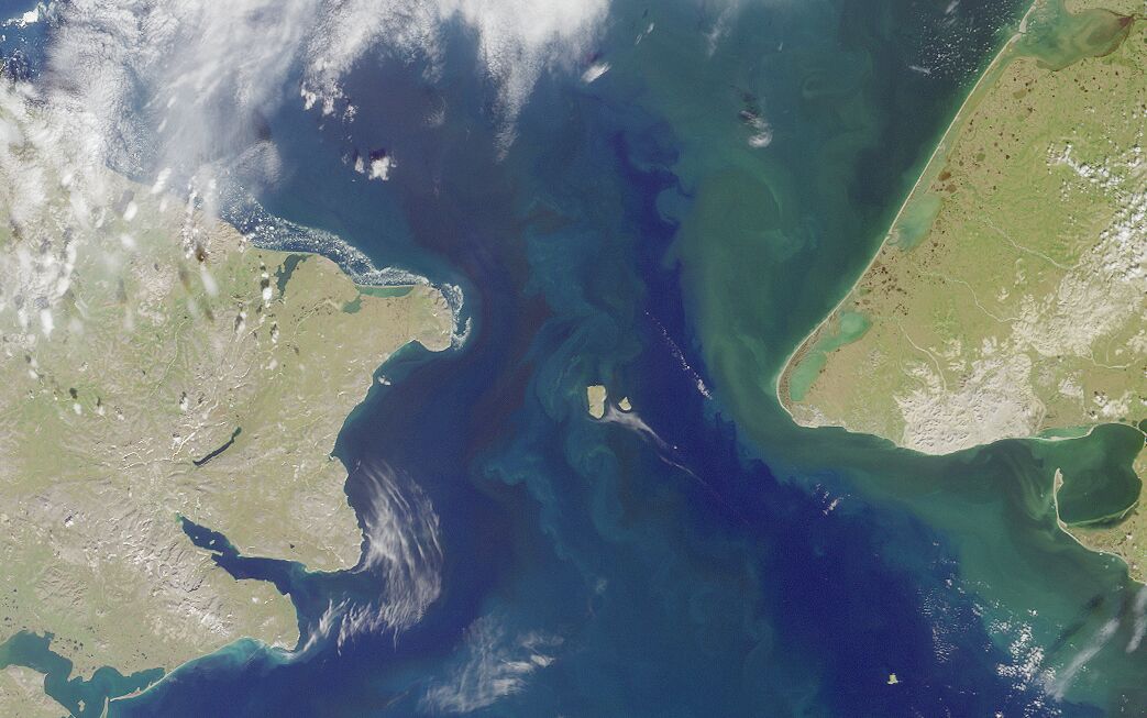 Satellite photo of the Bering Strait, with the Diomede Islands at center. Image from NASA